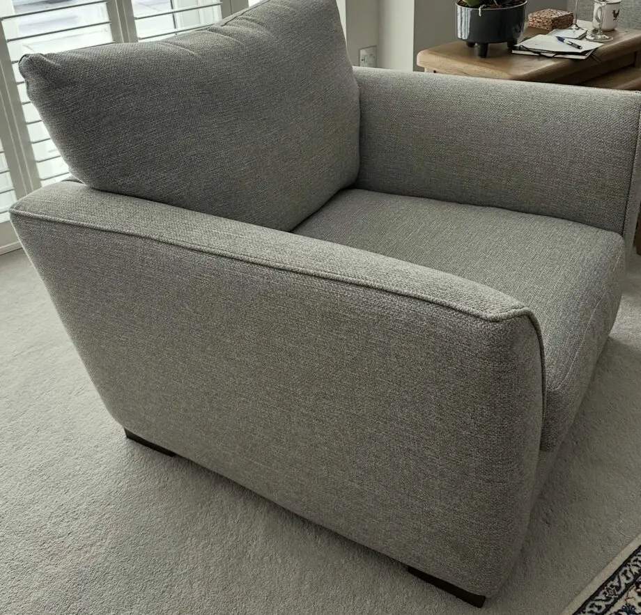 Corner sofa with an armchair and a footstool