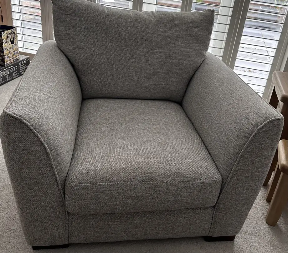 Corner sofa with an armchair and a footstool