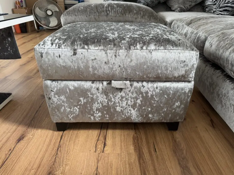 Crushed velvet grey corner sofa from DFS with matching footstool with storage