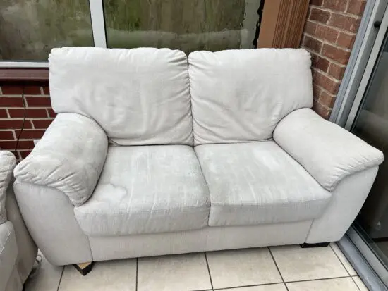 2 seater beige sofa