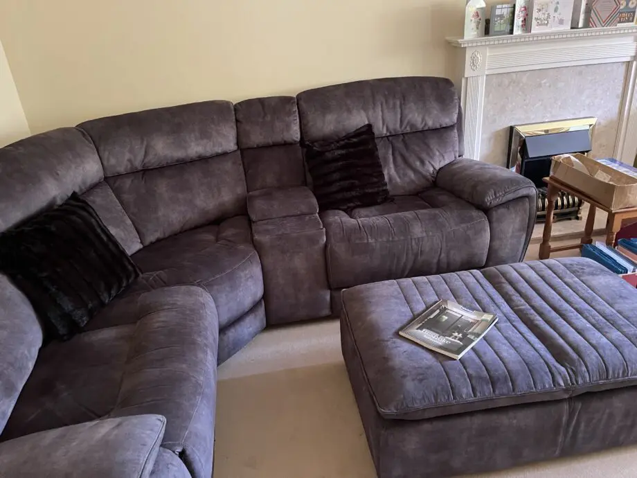 This is a fabric Sofology Radleigh Manual Recliner with Dual Footstool with Storage