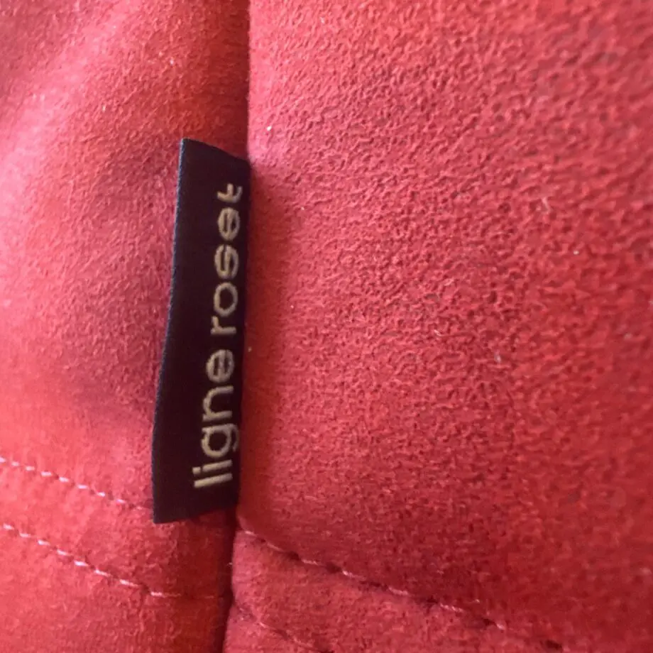 Line Roset Togo in Goya Red alcantara by Michel Ducaroy