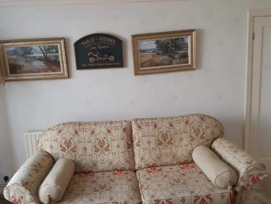Steedupholstery patterned beige three seater sofa