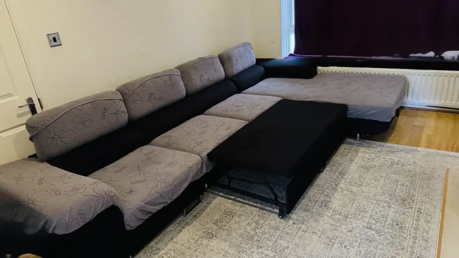 Sofa Bargain-Black corner sofa extendable made in Poland.