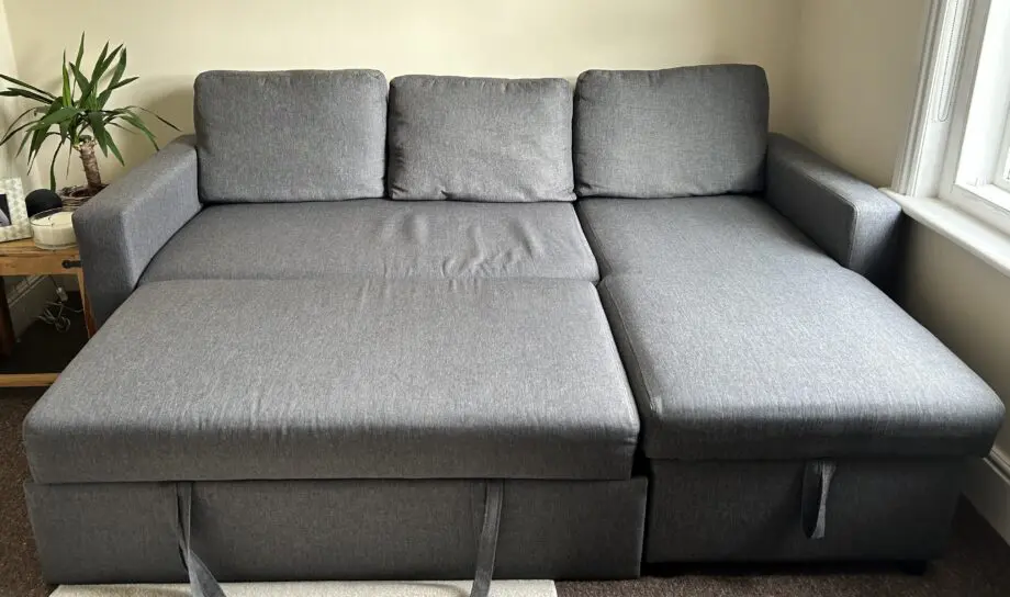 IKEA- Grey L-shaped Sofa Bed with storage