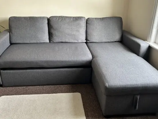 IKEA- Grey L-shaped Sofa Bed with storage