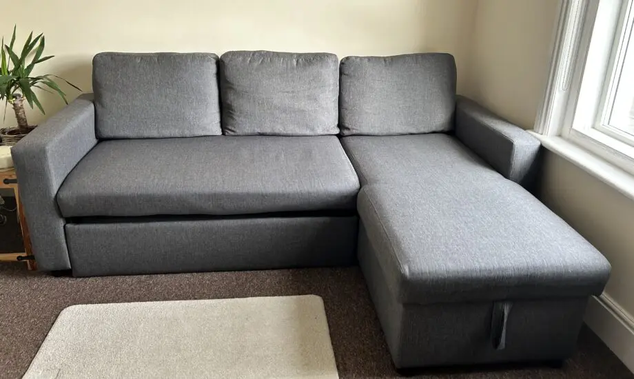 IKEA- Grey L-shaped Sofa Bed with storage