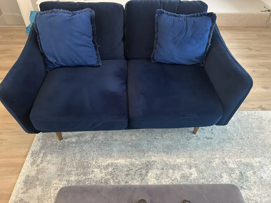 Snug velvet blue sofa