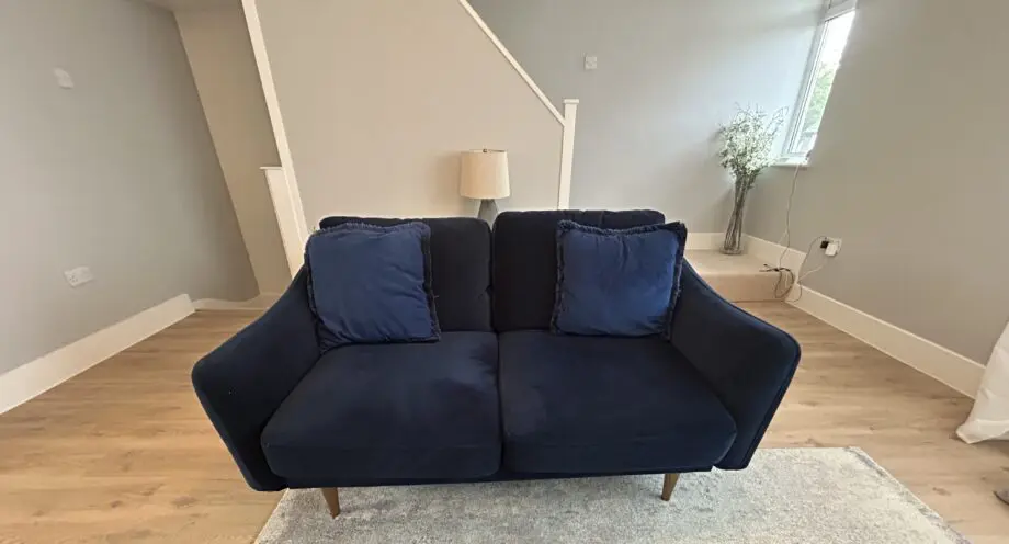 Snug velvet blue sofa