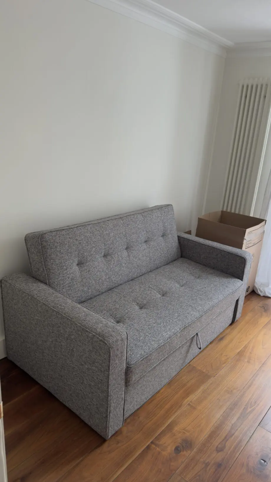 Grey 2-seater sofa bed used in excellent condition