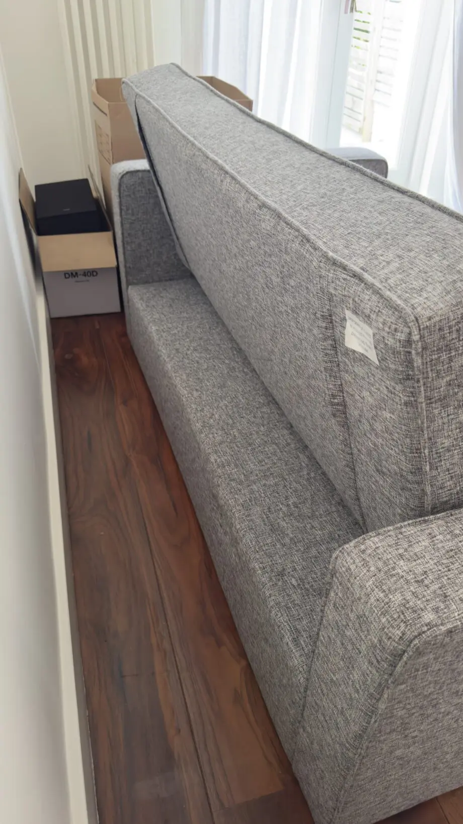 Grey 2-seater sofa bed used in excellent condition