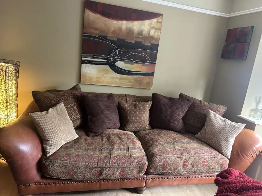 Furniture village tan leather arms and fabric seating 3 and 4 seater sofas