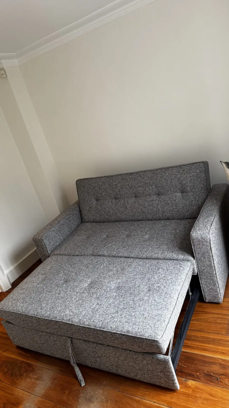 Grey 2-seater sofa bed used in excellent condition