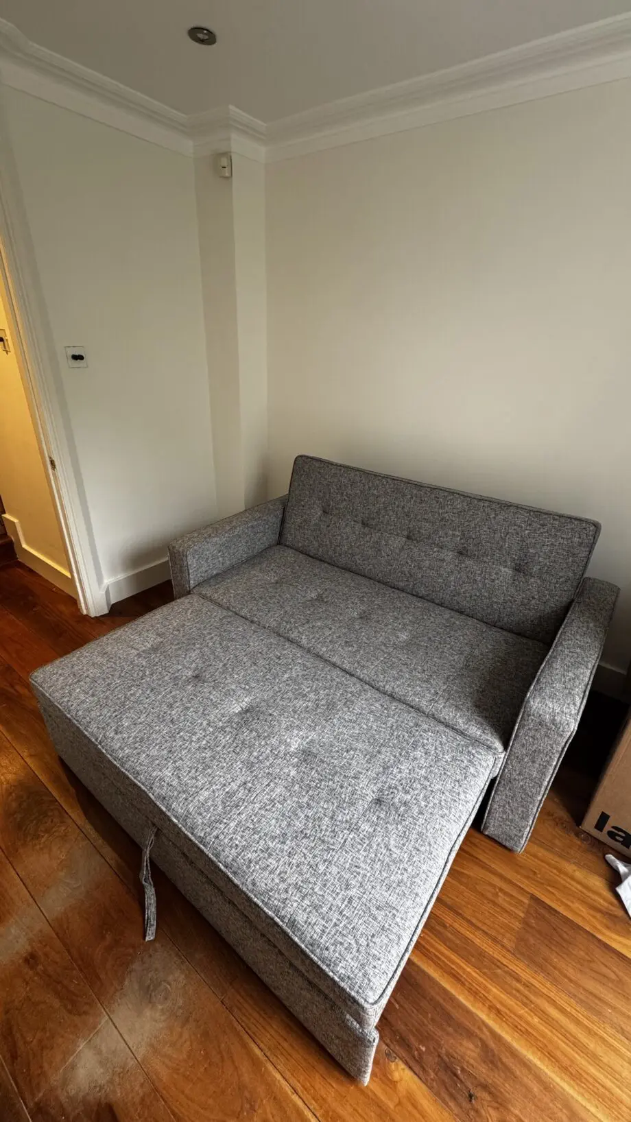 Grey 2-seater sofa bed used in excellent condition