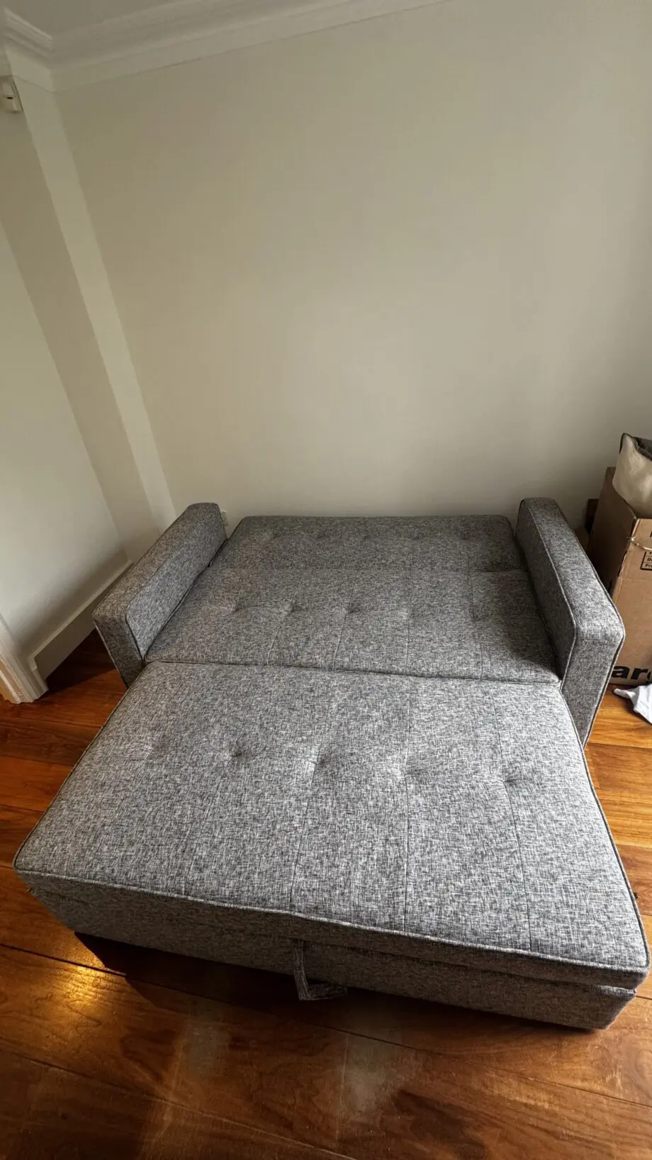 Grey 2-seater sofa bed used in excellent condition
