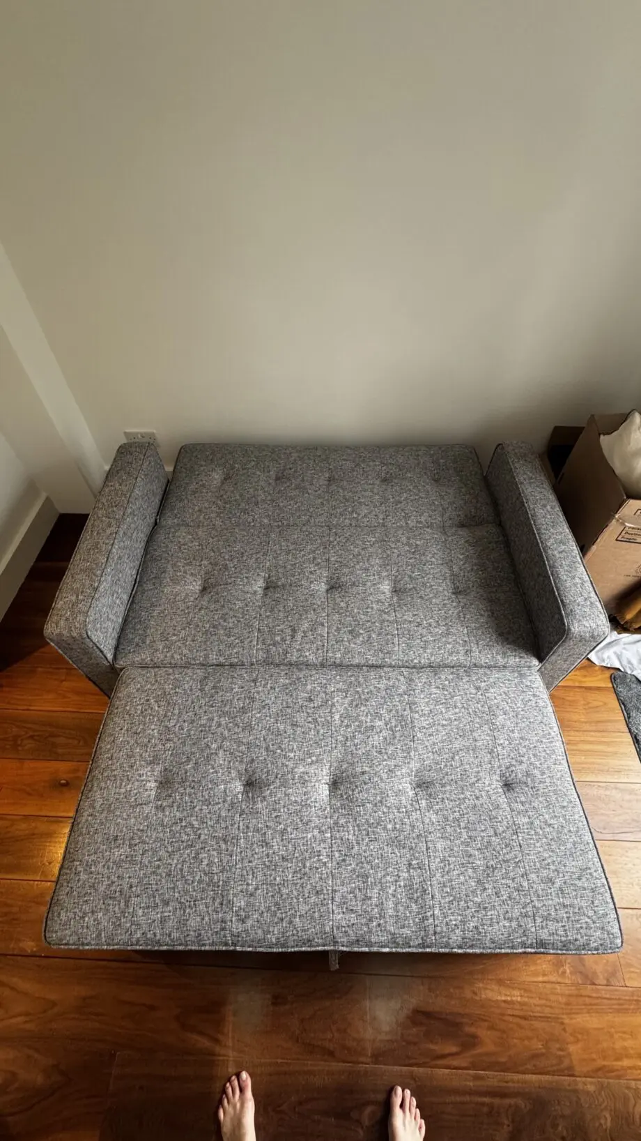 Grey 2-seater sofa bed used in excellent condition