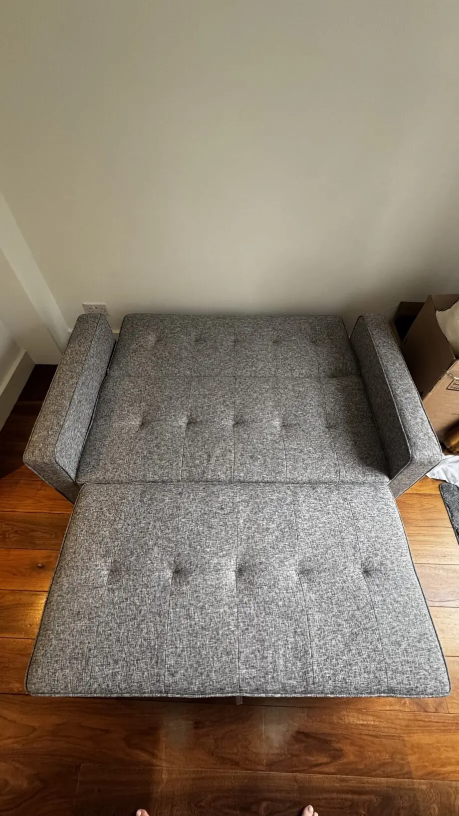 Grey 2-seater sofa bed used in excellent condition