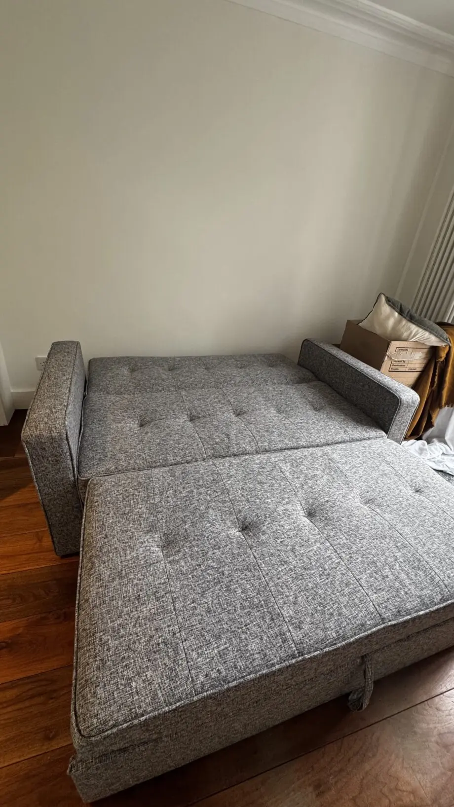 Grey 2-seater sofa bed used in excellent condition
