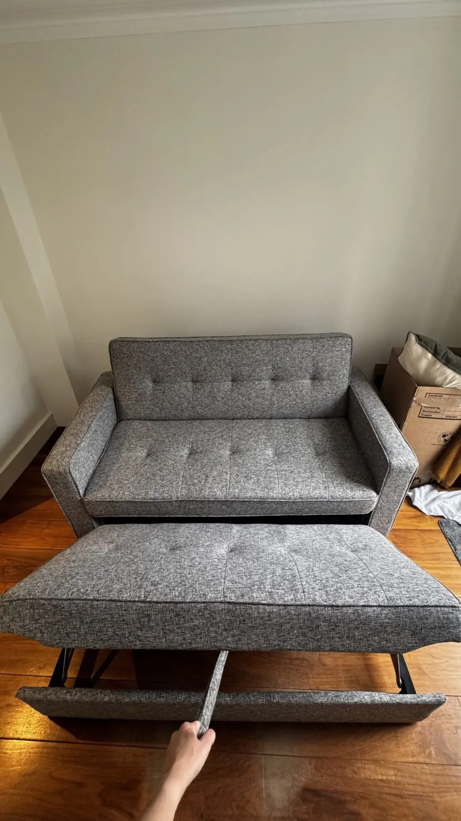 Grey 2-seater sofa bed used in excellent condition