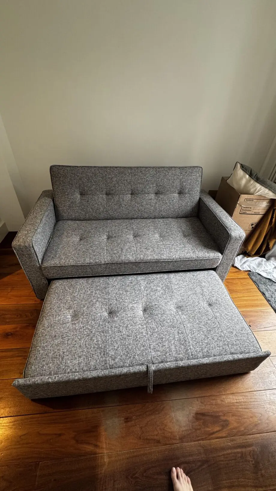 Grey 2-seater sofa bed used in excellent condition