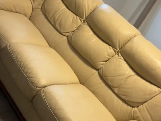 Italian leather cream sofa and armchair