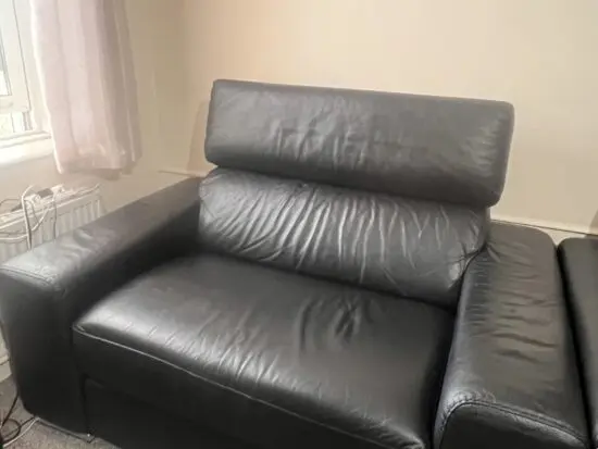 DFS black leather 2 seater sofa