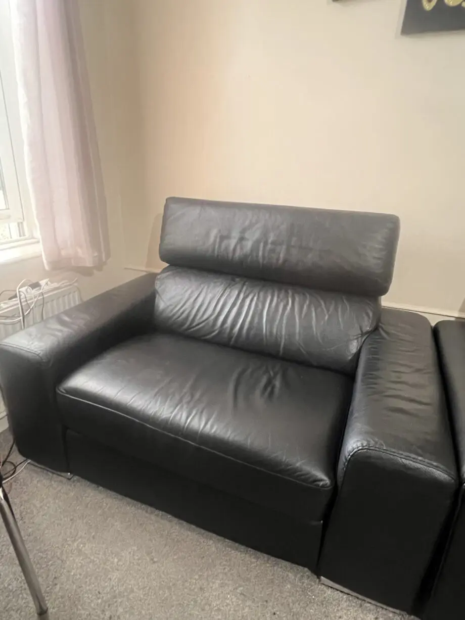 DFS black leather 2 seater sofa