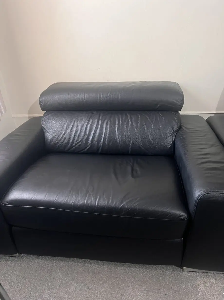 DFS black leather 2 seater sofa