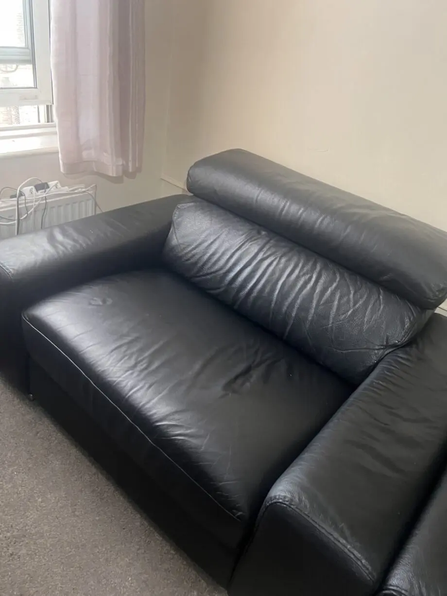DFS black leather 2 seater sofa