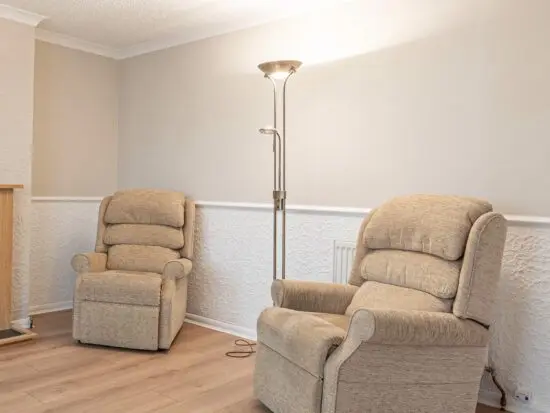 One electric recline and one normal recliner arm chair arm chair
