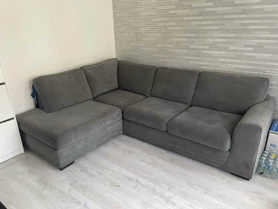 DFS grey ORKA corner sofa with matching foot stool