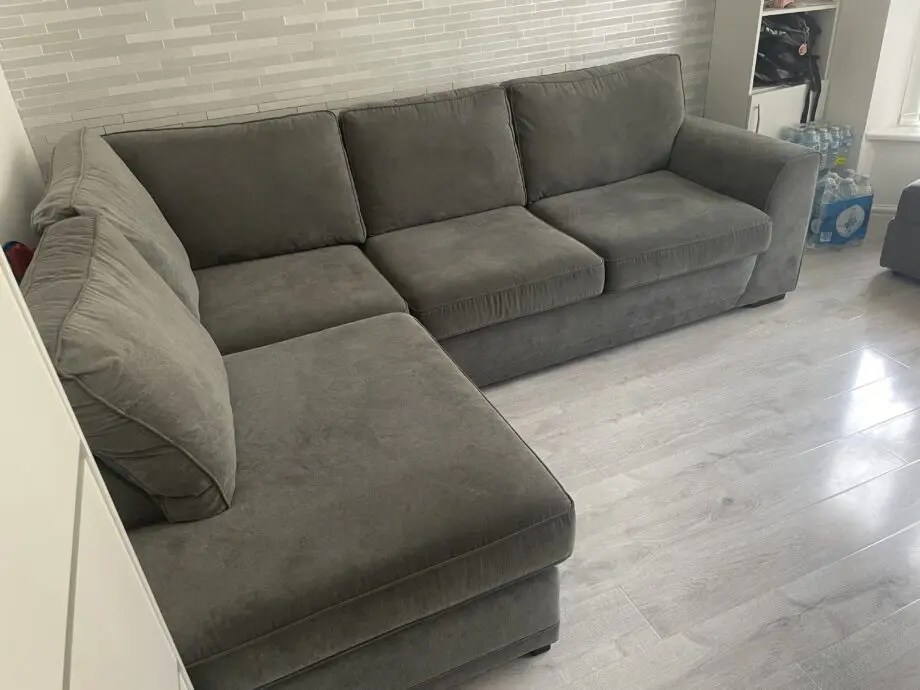 DFS grey ORKA corner sofa with matching foot stool