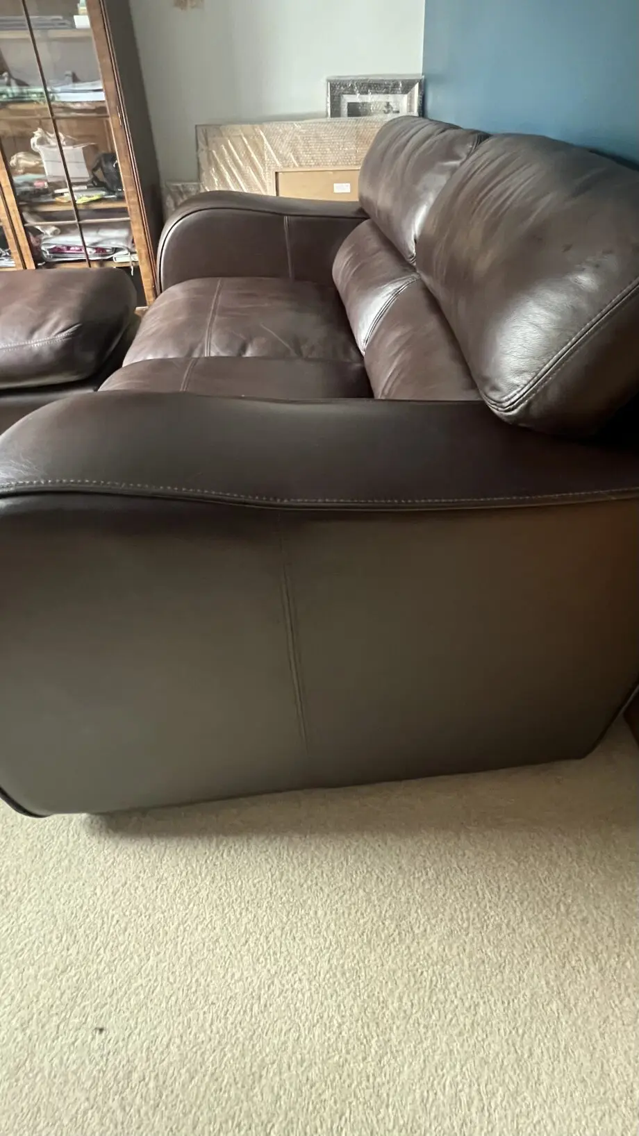 Brown leather 2 seater and matching footstool