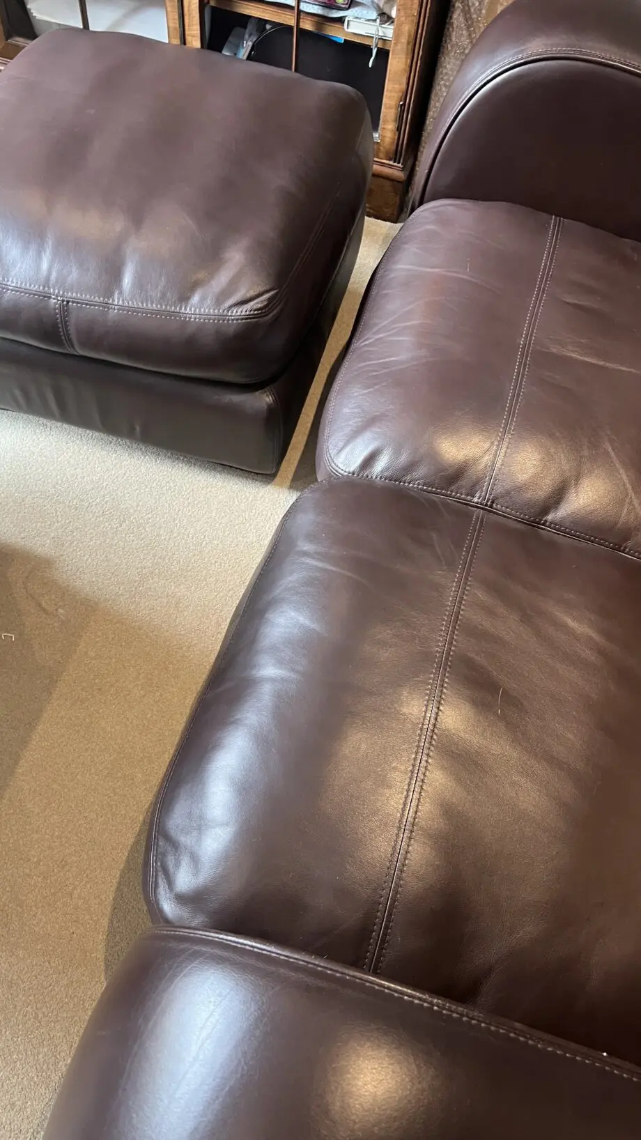 Brown leather 2 seater and matching footstool