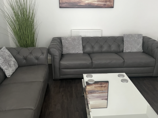 Dark grey 3 seater Natuzzi sofa