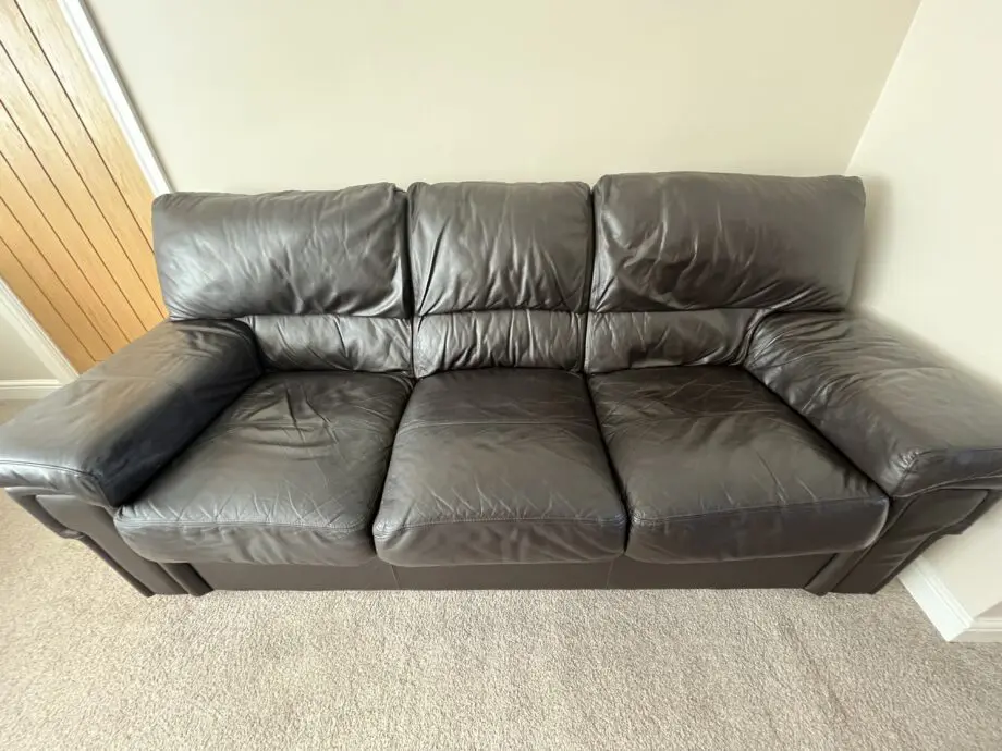 Dark brown leather 3 seater sofa, armchair & footstool