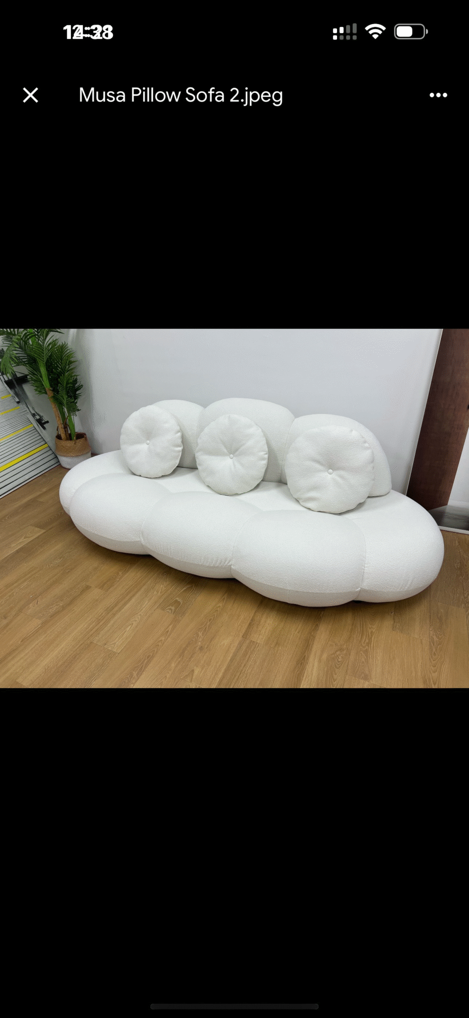 Musa Pillow Sofa Introducing the Musa Pillow Sofa, a contemporary piece that combines elegance and comfort in one. This armless sofa is designed with luxurious wool-feel polyester fiber upholstery and comes with pillows to enhance your relaxation experience. It's the perfect addition to your living room for both style and coziness.
