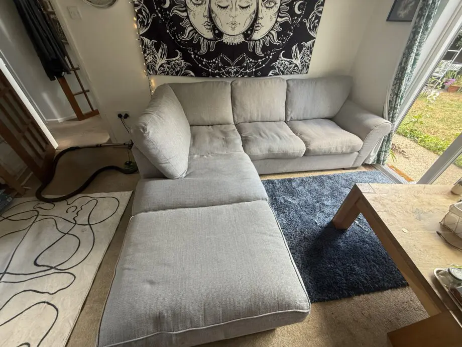 Grey corner sofa + footstool