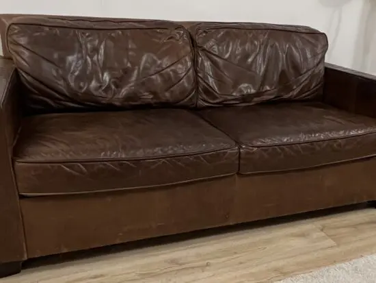 Brand: West Elm, item: leather sofa , chocolate molasses colour .