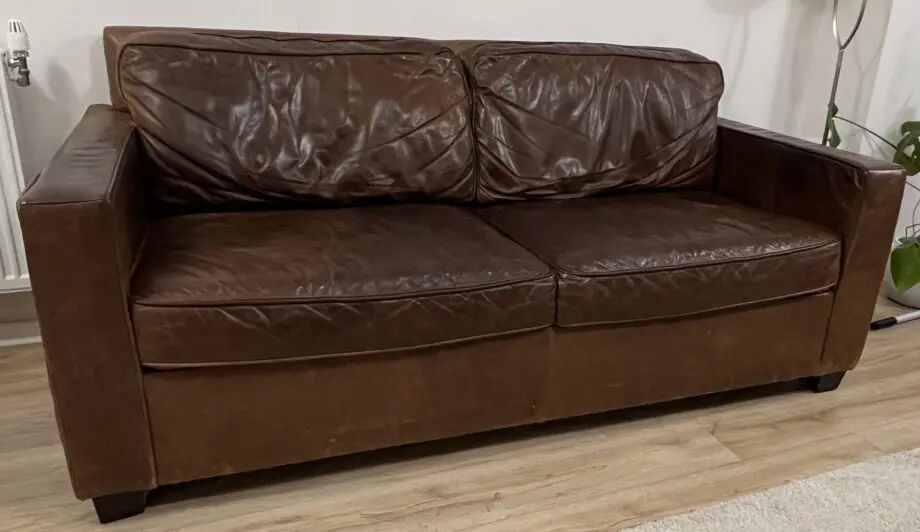 Brand: West Elm, item: leather sofa , chocolate molasses colour .