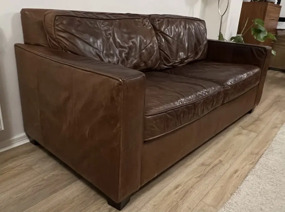 Brand: West Elm, item: leather sofa , chocolate molasses colour .