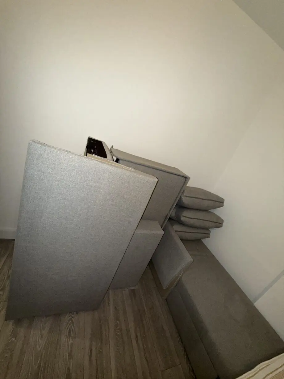 Corner sofa-bed with storage light gray