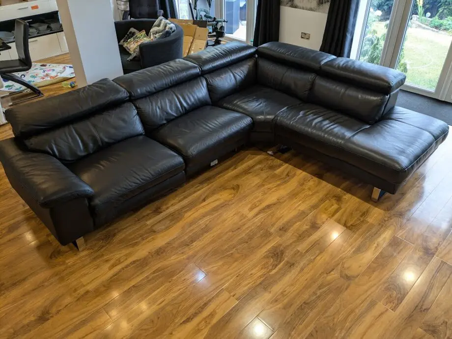 DFS, Black Leather corner sofa, great condition. Adjustable head restraints, electric wide footrestlegs.