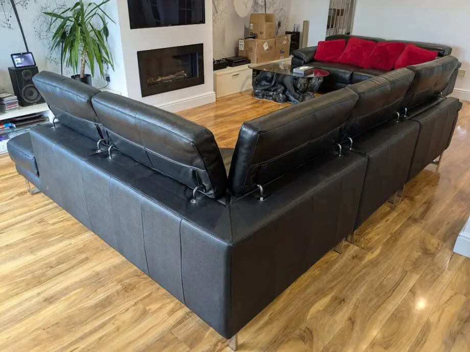 DFS, Black Leather corner sofa, great condition. Adjustable head restraints, electric wide footrestlegs.