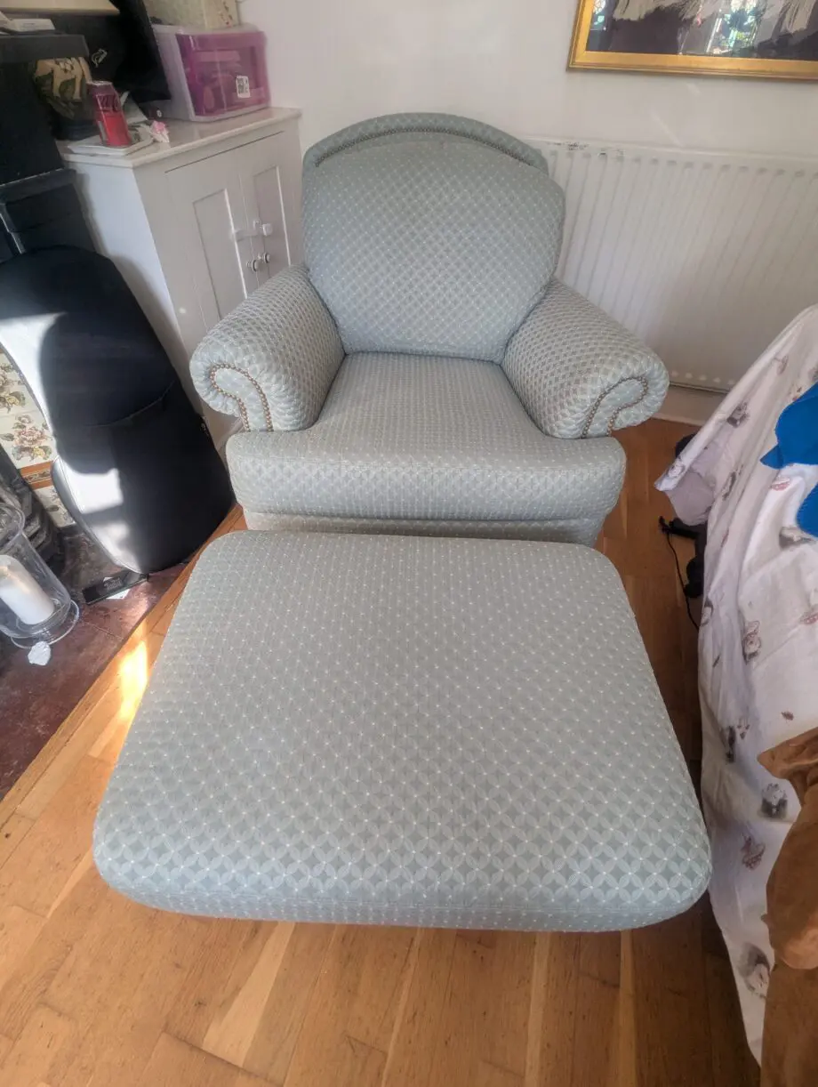 Seafoam teal overstuffed chair and footstool with nail detailing