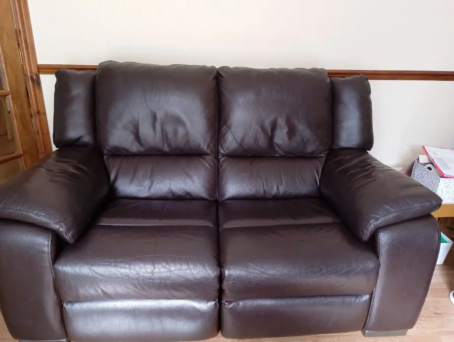 Harvey's dark brown Italian leather reclining sofas x 2