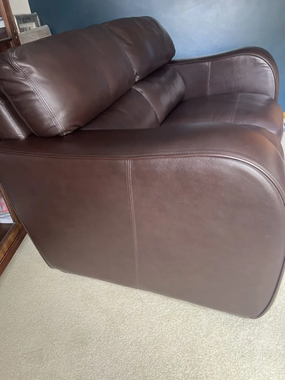 Brown leather 2 seater and matching footstool