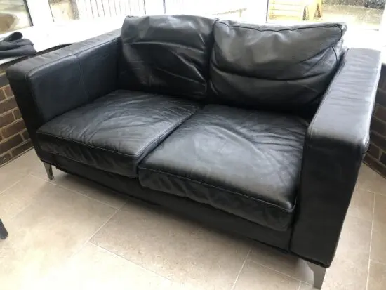 Two IKEA 2 seat sofas black leather