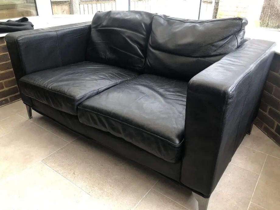 Two IKEA 2 seat sofas black leather