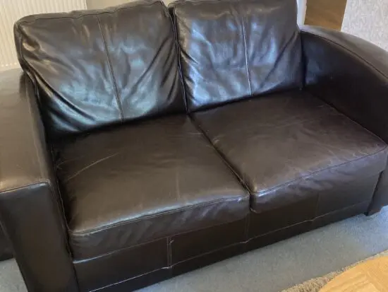 Very dark brown leather two seater matching sofas
